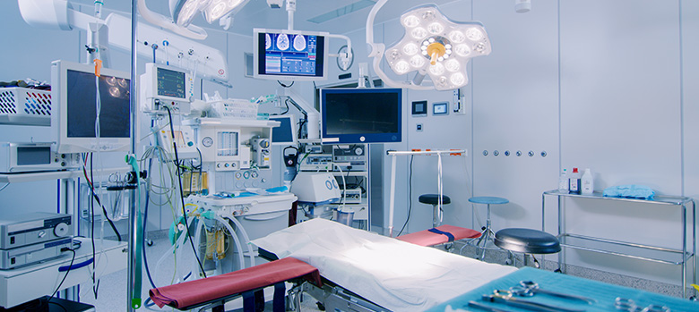 Operating room with medical equipment all around