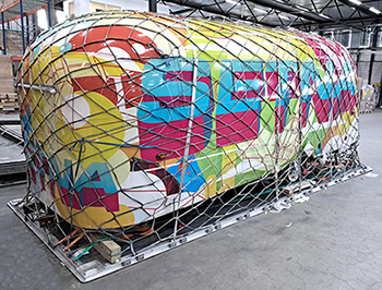 Airstream trailer strapped, on a pallet, and ready for transport